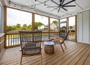 Screened lanai with seating overlooking a backyard pool, the kind of lanai and patio screening we install across South Florida