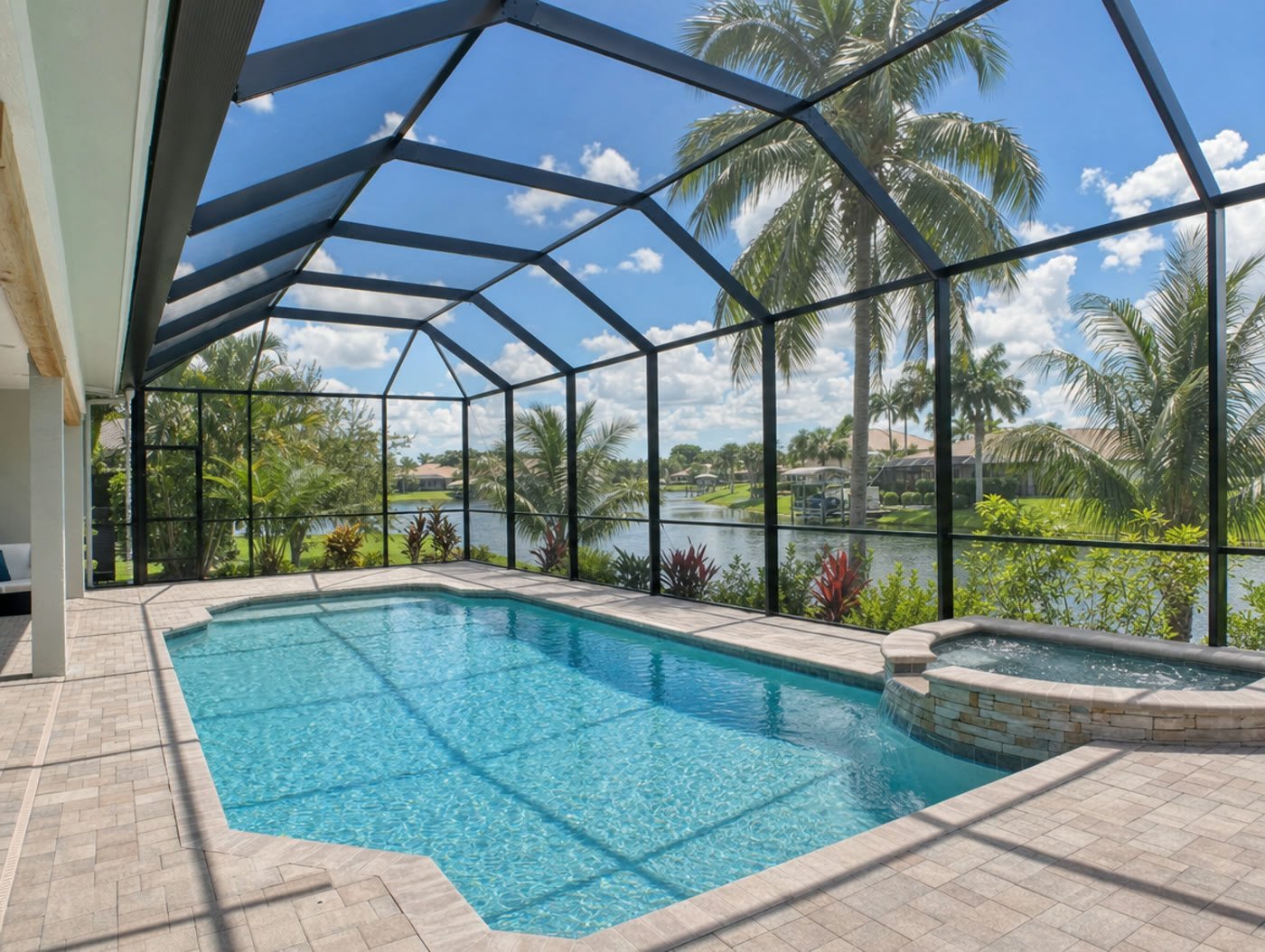 Restored bronze aluminum pool cage with fresh paint and new screen mesh over a South Florida pool